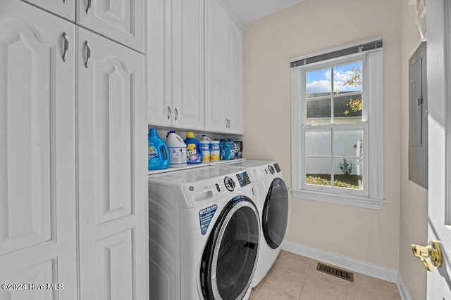 109 St Gallen Ct, New Bern, NC 28562 - laundry area with cabinet space, baseboards, independent washer and dryer, and light tile patterned floors