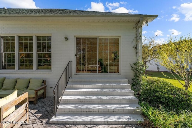 109 St Gallen Ct, New Bern, NC 28562 - entrance to property with brick siding, a patio, and an outdoor hangout area