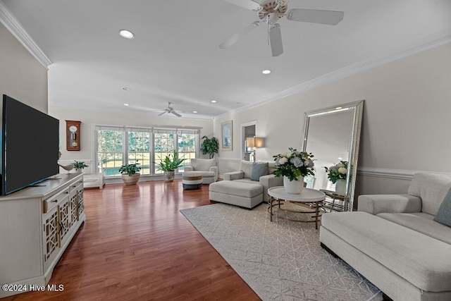 living room featuring crown molding, ceiling fan, and wood-type flooring