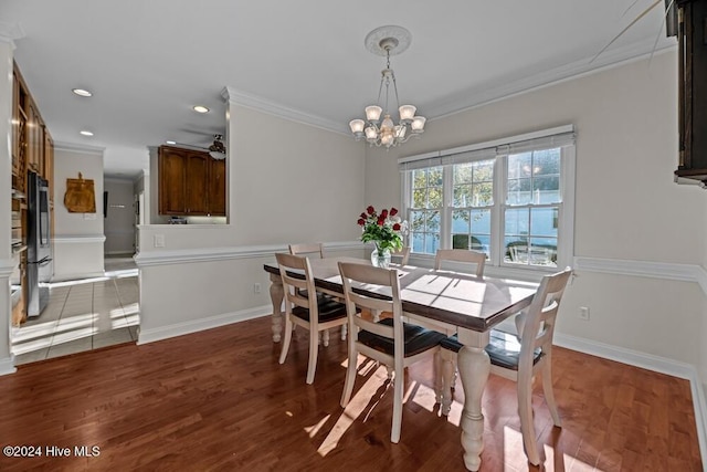 109 St Gallen Ct, New Bern, NC 28562 - dining space featuring ornamental molding, a chandelier, wood finished floors, baseboards, and recessed lighting