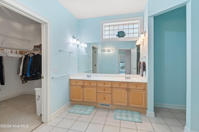 bathroom featuring tile patterned flooring and vanity