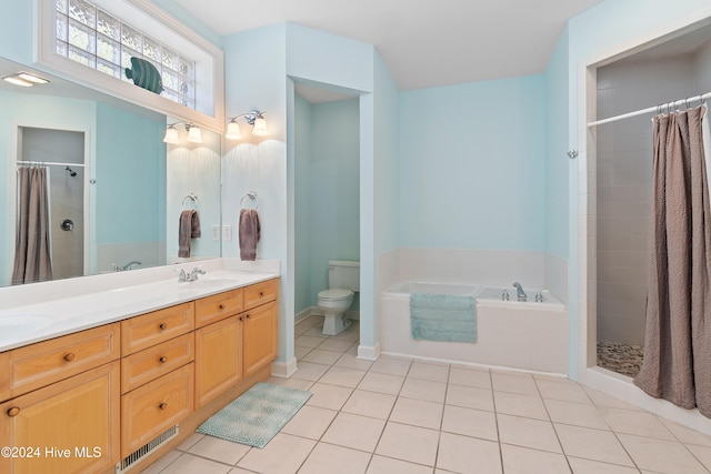 full bathroom with tile patterned flooring, vanity, separate shower and tub, and toilet