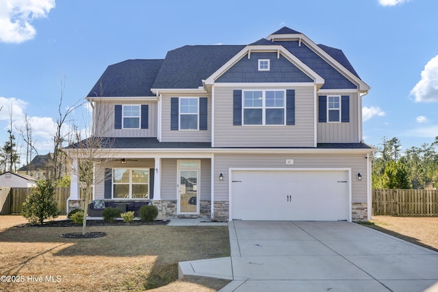 craftsman house featuring a front lawn and a garage