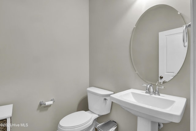 bathroom with toilet and sink