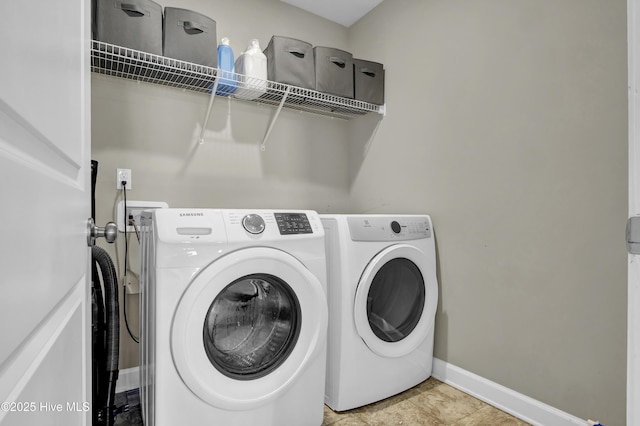 clothes washing area with separate washer and dryer