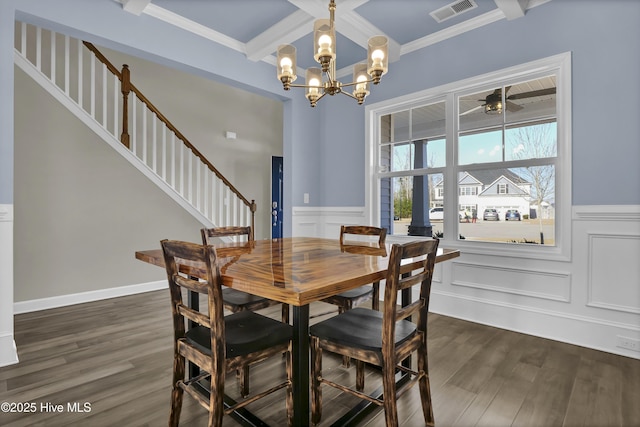 dining area with beamed ceiling, dark hardwood / wood-style flooring, ceiling fan with notable chandelier, and crown molding