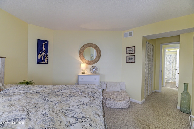 2000 New River Inlet Rd Unit 1203, North Topsail Beach, NC 28460 - carpeted bedroom with baseboards and a closet