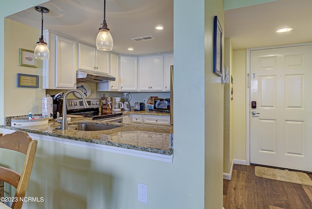 2000 New River Inlet Rd Unit 1203, North Topsail Beach, NC 28460 - kitchen featuring under cabinet range hood, stone countertops, stainless steel electric range, a sink, and recessed lighting