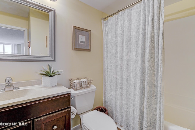 2000 New River Inlet Rd Unit 1203, North Topsail Beach, NC 28460 - bathroom featuring vanity, toilet, and shower / bathtub combination with curtain