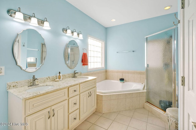 bathroom featuring tile patterned floors, vanity, and plus walk in shower