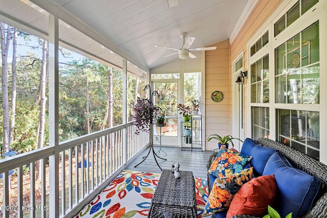 sunroom featuring ceiling fan and vaulted ceiling