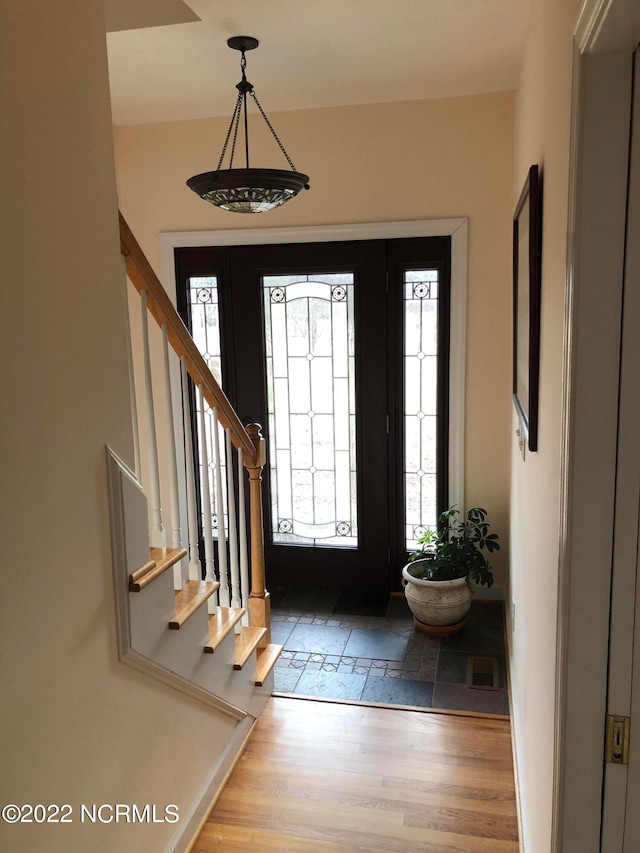 foyer entrance with hardwood / wood-style floors