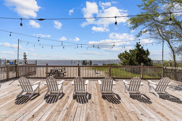 wooden deck featuring a water view