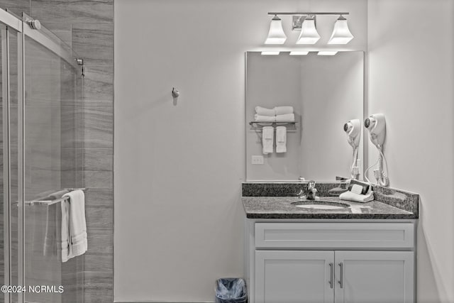 bathroom with vanity and an enclosed shower