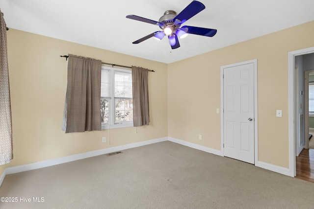 unfurnished bedroom featuring ceiling fan and carpet