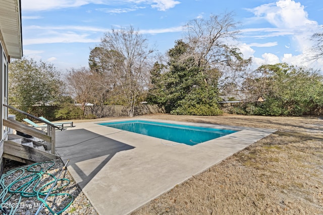 view of swimming pool featuring a patio area