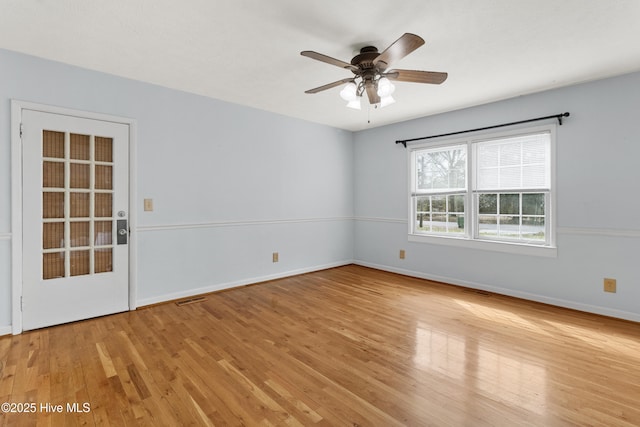 unfurnished room featuring light hardwood / wood-style floors and ceiling fan