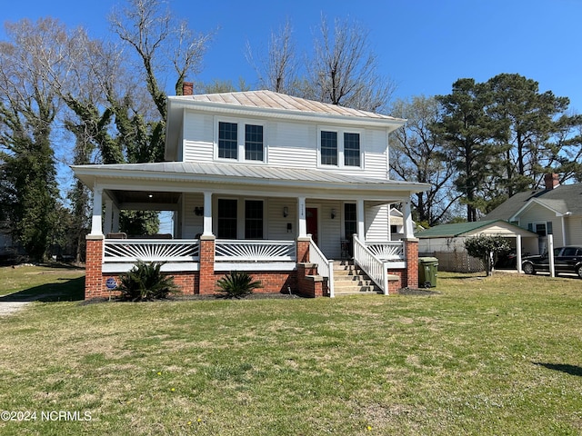 view of front of house with a porch and a front lawn