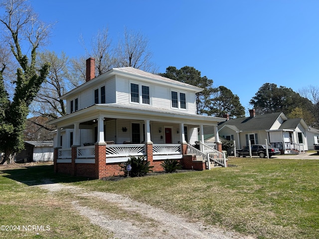 country-style home with a front lawn