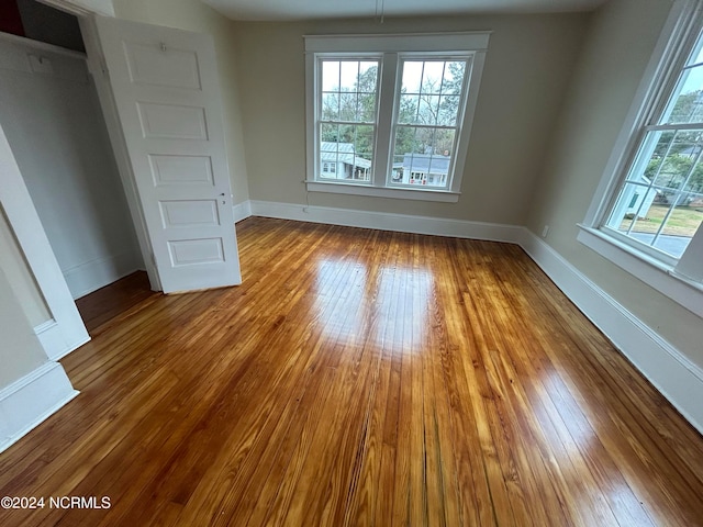 unfurnished dining area with hardwood / wood-style flooring