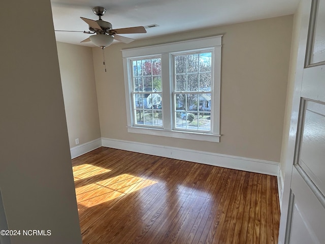 unfurnished room with hardwood / wood-style flooring and ceiling fan