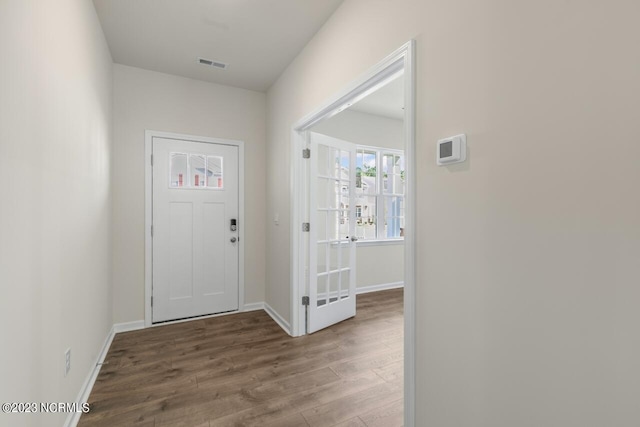 foyer entrance with hardwood / wood-style floors