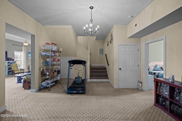 workout room with crown molding, light carpet, and a chandelier