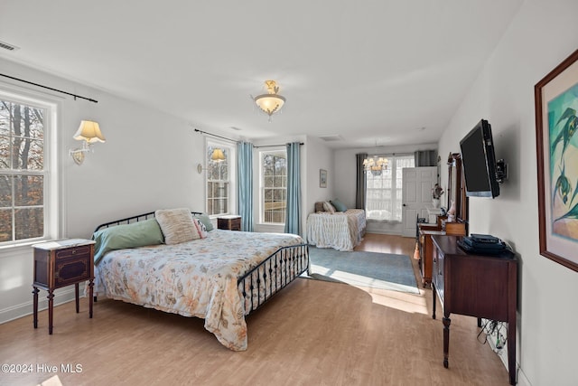 bedroom with wood-type flooring