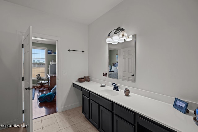 bathroom featuring tile patterned flooring and vanity