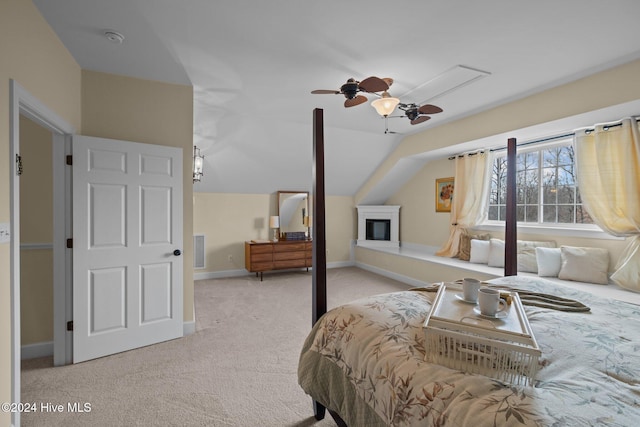 carpeted bedroom with vaulted ceiling and ceiling fan