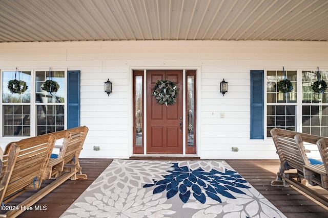 entrance to property with a porch