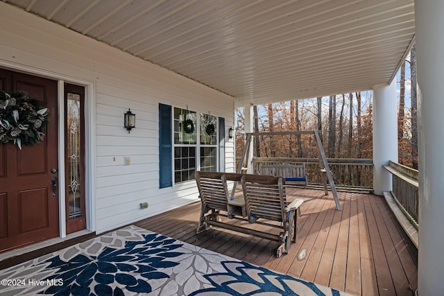 wooden terrace featuring a porch