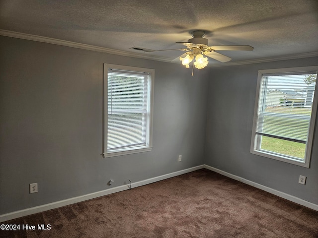 spare room featuring carpet, ceiling fan, ornamental molding, and a textured ceiling