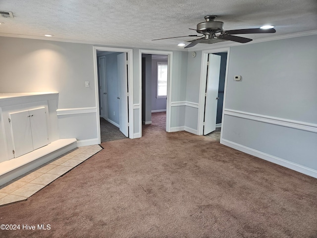 unfurnished living room with a textured ceiling and light carpet