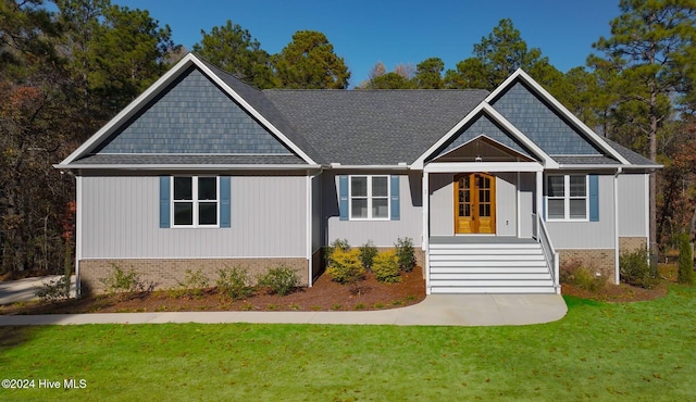 view of front of property with french doors and a front yard