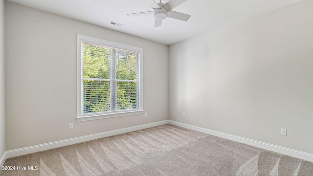 carpeted empty room with ceiling fan