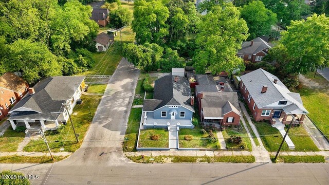 birds eye view of property with a residential view
