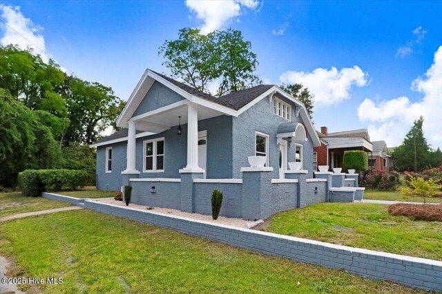 view of property exterior with a lawn