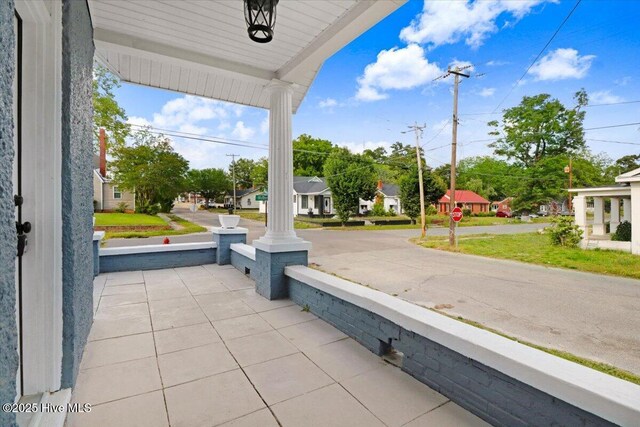 view of patio with a porch and a residential view