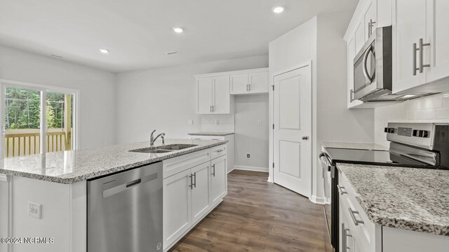 kitchen featuring dark hardwood / wood-style flooring, white cabinetry, sink, and appliances with stainless steel finishes