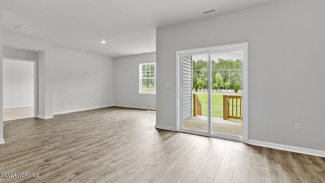 unfurnished room featuring hardwood / wood-style floors