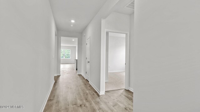 corridor featuring light hardwood / wood-style flooring