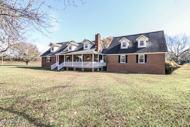 exterior space featuring a porch and a front lawn