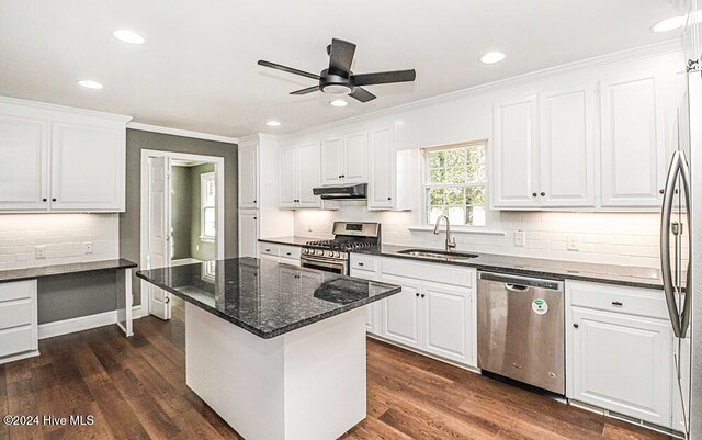 kitchen with sink, white cabinets, stainless steel appliances, and dark hardwood / wood-style floors