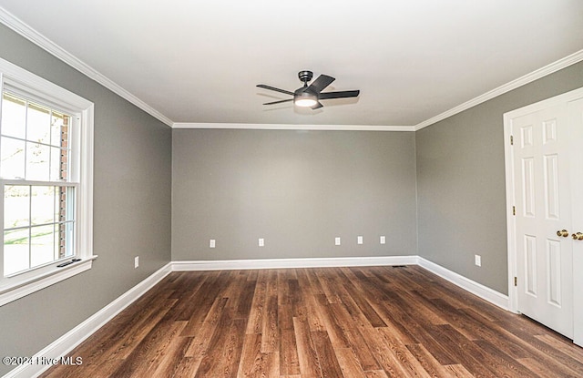 empty room featuring crown molding, dark hardwood / wood-style flooring, and ceiling fan