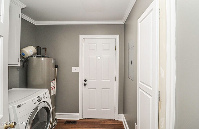 washroom with cabinets, electric water heater, dark wood-type flooring, crown molding, and washer / clothes dryer