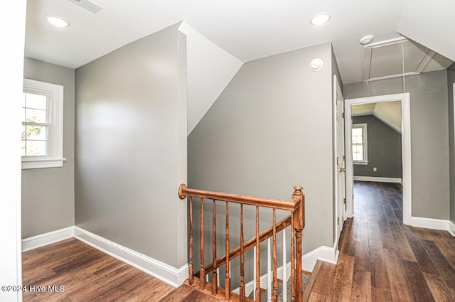 hall featuring dark hardwood / wood-style flooring and lofted ceiling