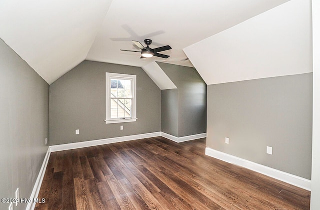 bonus room with vaulted ceiling, ceiling fan, and dark hardwood / wood-style floors