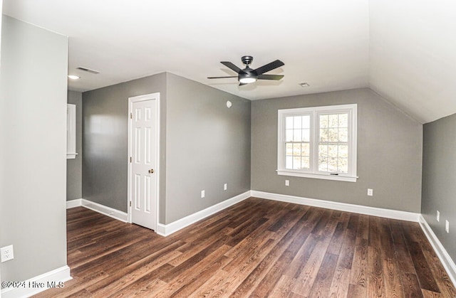 bonus room featuring vaulted ceiling, ceiling fan, and dark wood-type flooring