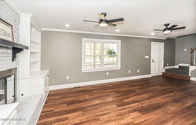 unfurnished living room with a fireplace, dark hardwood / wood-style floors, and ornamental molding